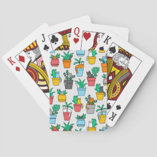 Cats in the flowerpots playing cards