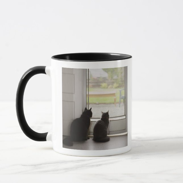 Cats looking out screen door mug (Left)