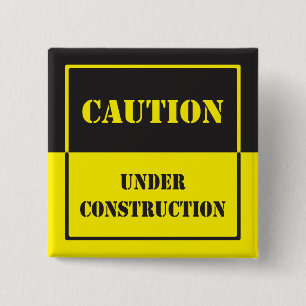 caution sign under construction 15 cm square badge