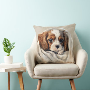 CAVALIER KING CHARLES SPANIEL PUPPY UNDER BLANKET CUSHION