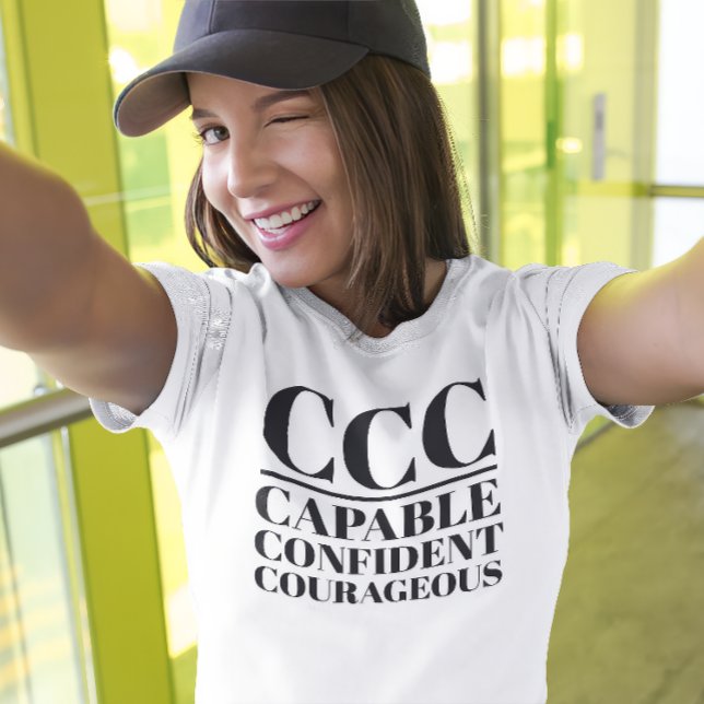 CCC- Capable, Confident, Courageous T-Shirt (Young woman wears a "CCC:Capable, Confident, Courageous" white t-shirt.)