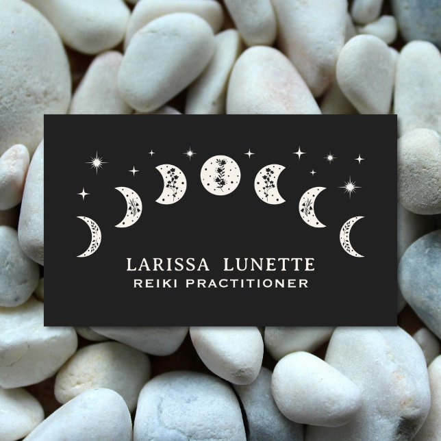 Celestial Moon Phases Floral Mystical Holistic Business Card (Reiki Practitioner business card with a floral moon design. White pebbles in the background. )
