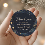 Celestial Navy Gold Wedding Thank You Classic Round Sticker<br><div class="desc">Add a polished finishing touch to your wedding details with this elegant celestial wedding thank you sticker, featuring a deep navy blue background, refined gold starry accents, and romantic celestial typography. Inspired by the night sky and cosmic motifs, this sticker is perfect for expressing gratitude while maintaining a cohesive, luxurious...</div>