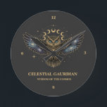 Celestial Owl Cosmic Guardian Round Clock<br><div class="desc">A stunning mystical owl design featuring galaxy-filled wings,  glowing blue eyes,  and a radiant lunar cycle above. Decorated with gold celestial details and cosmic stardust,  this artwork blends wisdom,  magic,  and astronomy into one powerful symbol. Perfect for lovers of owls,  mysticism,  astrology,  cosmic art,  and spiritual aesthetic designs.</div>