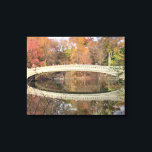 Central Park - Bow Bridge - Autumn Canvas Print<br><div class="desc">Bow Bridge Central Park. NYC in the Fall — at the right moment — with the full reflection of the bridge in the water. A beautiful art landscape photo of this famous and romanticised bridge -- the detail in the architecture -- the autumn colours and the amazing reflection caught at...</div>
