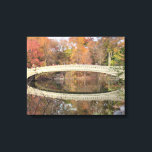Central Park - Bow Bridge - Autumn Canvas Print<br><div class="desc">Bow Bridge Central Park. NYC in the Fall — at the right moment — with the full reflection of the bridge in the water. A beautiful art landscape photo of this famous and romanticised bridge -- the detail in the architecture -- the autumn colours and the amazing reflection caught at...</div>