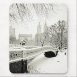 Central Park Winter - Snow on Bow Bridge Mouse Mat<br><div class="desc">This fine art photo features a beautiful winter landscape in Central Park, New York City in classic black and white. Snow covers Bow Bridge, one of Central Park's most famous works of architecture. The towers of San Remo sit in the distance as seen through the bare branches of trees heavy...</div>