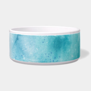 Ceramic pet bowl with a teal watercolor design. 
