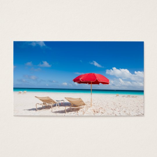 Chairs and umbrellas on a tropical beach business card