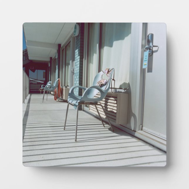 Chairs Outside Beach Hotel Rooms Plaque (Front)