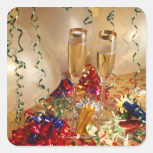 Champagne flutes, streamers and noisemakers square sticker