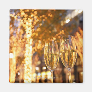 Champagne glasses toasting Christmas on city Magnet