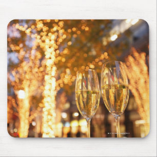 Champagne glasses toasting Christmas on city Mouse Mat