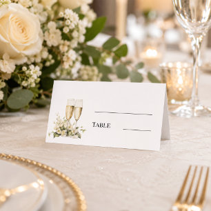 Champagne glasses white florals monogrammed table place card