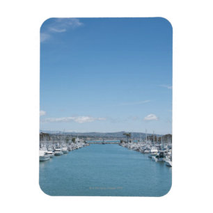channel in harbour on a sunny day with blue sky magnet