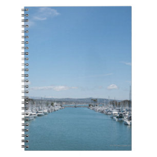 channel in harbour on a sunny day with blue sky notebook