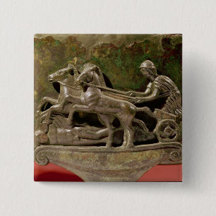Charioteer in his chariot, detail from a cist 15 cm square badge