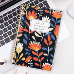 Cheerful Orange Floral Pattern Personalised 2025 Planner<br><div class="desc">Personalise this planner with your name in black italics framed by a white rectangle,  on a bold,  cheerful pattern of orange and white flowers on a black background.</div>
