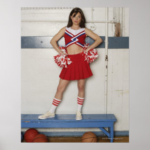 Cheerleader standing on bench near basketballs, poster