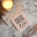 Cheers to Love Blush Black Wedding Square Paper Coaster<br><div class="desc">Romantic wedding coasters featuring "Cheers to Love" in bold mixed typography with elegant calligraphy accents and a delicate arrow detail on a soft blush pink background. A charming reception table accent or cocktail hour favour that celebrates the occasion with style. No personalisation needed — ready to complement any wedding palette....</div>