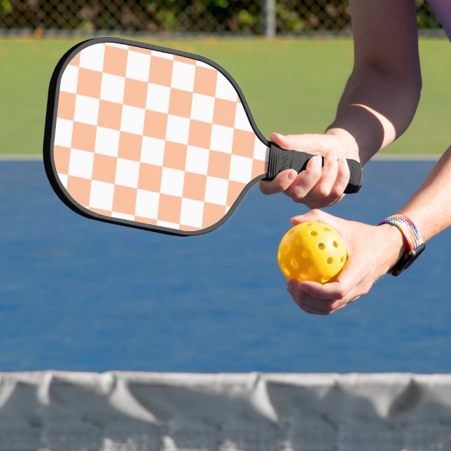 Chequered squares peach orange white geometric pickleball paddle (Insitu)