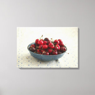 Cherries in a blue bowl canvas print