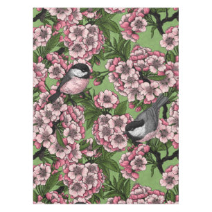 Cherry blossom and chickadees on green tablecloth