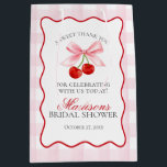 Cherry Sweet Pink Coquette Bow Bridal Shower Favou Medium Gift Bag<br><div class="desc">Someone cherry sweet is tying the knot and you’re the cherry on top of their sweet celebration. Add a nostalgic touch to your bridal shower with this Pink Gingham Cherry Party Decor featuring vibrant red cherries and pastel pink gingham, all within a whimsical wavy border. With this playful design, get...</div>