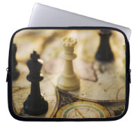 Chess pieces on old world map