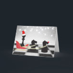 Chess Santa Claus and Reindeer Christmas Holiday Card<br><div class="desc">This funny chess Christmas card design features Santa's sleigh and reindeer. The Santa Claus is the King chess piece wearing a Santa hat and the reindeer are two Knight chess pieces. They are on a chessboard in front of a winter snow scene with holiday lights. Easily customise the inside with...</div>