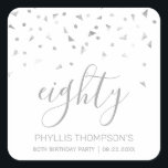 Chic 80th Birthday Party Silver Confetti Square Sticker<br><div class="desc">Help her celebrate her 80th birthday in style with this simple but elegant design, featuring faux silver triangular confetti sifting down on the word "eighty" in silver grey handwriting font on a white background. Personalise it with the name of the honoree in silver grey sans serif font, along with the...</div>
