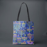 Chic Blue Gold Menorah Star of David Hanukkah Tote Bag<br><div class="desc">This holiday tote bag features a chic pattern of gold,  green and purple menorah and gold Star of David on a blue background. Designed by world renowned artist Tim Coffey.</div>