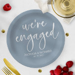 Chic Calligraphy We're Engaged Engagement Party Paper Plate<br><div class="desc">A stylish calligraphy engagement party paper plate. Easy to personalise with your details. CUSTOMIZATION: If you need design customisation,  please contact me through chat; if you need information about your order,  shipping options,  etc.,  please get in touch with Zazzle support directly.</div>