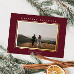 Chic Minimalist Elegance Burgundy Christmas Photo Foil Holiday Card<br><div class="desc">This elegant holiday photo card features one horizontal photo, classic raised foil frame around the photo, and a greeting in raised foil over a burgundy red background. The greeting on the front is editable so it's easily changed to anything you like. The back of the card is the same burgundy...</div>