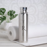 Chic Monogram on Silver Water Bottle<br><div class="desc">Chic black vertical monogram on silver features a larger more decorative initial in the centre. Replace the 3 initials with your own in the sidebar.

Other water bottle colours and styles available in the sidebar.

Copyright © Claire E. Skinner. All rights reserved.</div>