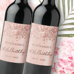 Chic Rose Gold Foil Glitter 80th Birthday Monogram Wine Label<br><div class="desc">Elegant Modern Rose gold glitter metallic Personalised Monogram Name 80th (or ANY AGE) Birthday Party Sparkling Wine Label. This Girly Adult feminine Birhday party design featuring a Monogram Name in a stylish handwritten calligraphy script and date and age on blush pink or rose gold faux brushed metallic foil look background...</div>