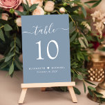 Chic Script Dusty Blue Wedding Reception Table Number<br><div class="desc">Chic dusty blue wedding reception table number sign with "table" in a stylish modern white script with swashes, the table number in elegant white serif typography, your first names joined by a heart and your reception date. Create each table number individually and add to your shopping cart one at a...</div>