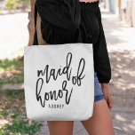 Chic Script Personalised Maid of Honour Tote Bag<br><div class="desc">Gift your maid of honour with this super cute personalised tote bag! Trendy and modern black and white design features "maid of honour" in black handwritten script typography. Easily customise with your maid of honour's name using the template field provided.</div>