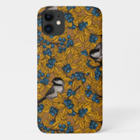 Chickadee birds on blueberry branches