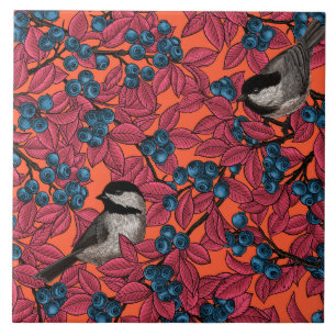Chickadee birds on blueberry branches on orange tile