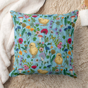 Chickens and wildflowers on baby blue cushion