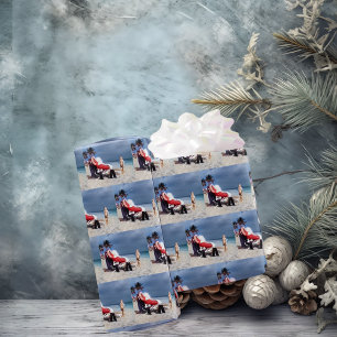 Child Looks At Santa Claus Sitting On Beach Wrapping Paper