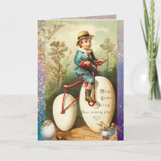 CHILD WITH EASTER EGG BIKE AND COLORFUL FLOWERS HOLIDAY CARD