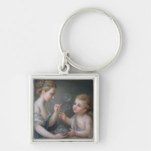 Children blowing bubbles key ring