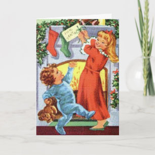 Children in footed pyjamas at Christmas Stockings Card