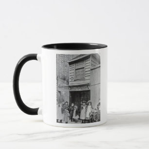 Children outside John Pounds's workshop Mug