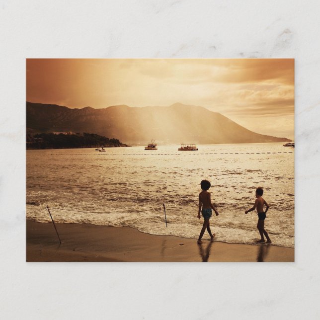 Children playing on the beach in sepia tones postcard (Front)