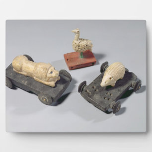 Children's toys: a hedgehog, a lion and a dove, Su Plaque