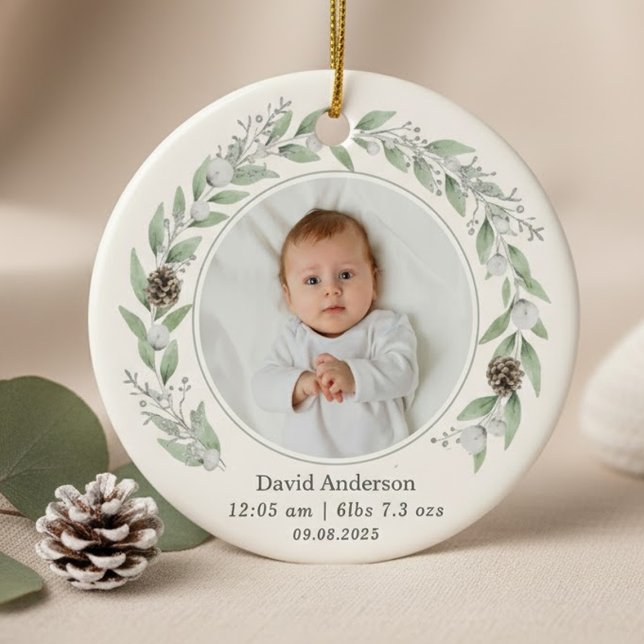 Child's Photo Holly Wreath Christmas 2025  Ceramic Tree Decoration (A round ornament featuring a central baby photo circled by a delicate watercolor greenery wreath.)