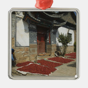 CHINA, Yunnan Province, Tianshengying. Drying Metal Tree Decoration